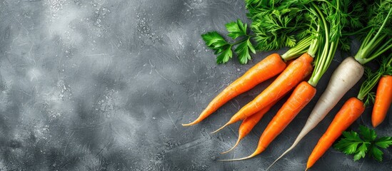 Sticker - A healthy eating concept featuring fresh carrots on a gray background, creating a frame of vegetables on a table in a raw and organic food copy space image.