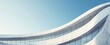 © ibnu - Modern building facade with curved concrete walls and windows reflecting blue sky