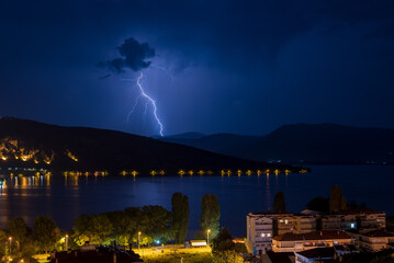 Wall Mural - lightning over the city of Kastoria Greece