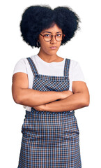 Canvas Print - Young african american girl wearing casual clothes skeptic and nervous, disapproving expression on face with crossed arms. negative person.