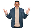 © Krakenimages.com - Young handsome hispanic man wearing business jacket and glasses celebrating victory with happy smile and winner expression with raised hands