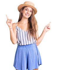 Wall Mural - Young beautiful blonde woman wearing summer hat smiling confident pointing with fingers to different directions. copy space for advertisement