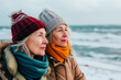 © Eva Corbella - Senior Woman And Her Daughter On The Beach On A Winter Day.
