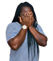 Canvas Print - Young black woman with braids wearing casual clothes with sad expression covering face with hands while crying. depression concept.