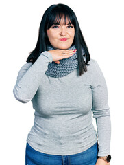 Poster - Young hispanic plus size woman wearing winter scarf cutting throat with hand as knife, threaten aggression with furious violence