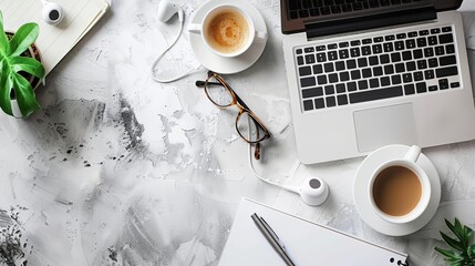 Wall Mural - Desk arrangement with a laptop eyeglasses earphones pen and a coffee cup Top view with space for text