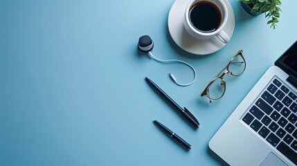Wall Mural - Desk arrangement with a laptop eyeglasses earphones pen and a coffee cup Top view with space for text