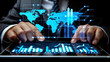 © Simon - Businessman working on a tablet with a world map above. Global business, data network and virtual connection concept.
