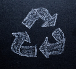 recycle symbol on black background