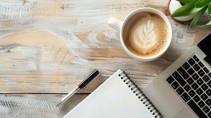 Wall Mural - Work from home concept Office desk setup with a laptop blank notepad coffee cup and pen on a wooden table Top view with copy space in a flat lay style