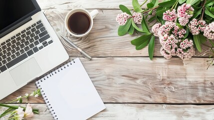 Wall Mural - Work from home concept Office desk setup with a laptop blank notepad coffee cup and pen on a wooden table Top view with copy space in a flat lay style