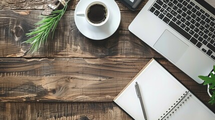 Wall Mural - Work from home concept Office desk setup with a laptop blank notepad coffee cup and pen on a wooden table Top view with copy space in a flat lay style