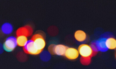 Grainy texture is adding a retro touch to this colorful bokeh over a dark background