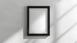 © practice  - Minimalist black frame on a white wall: a simple and elegant empty picture frame ready for artwork or photography display in a modern interior.