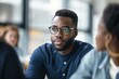 © Skyfe - Young African Businessman Glasses Thinking - Brainstorming Business Strategy Meeting