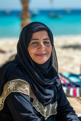 Wall Mural - Middle-aged Turkish woman enjoying beach vacation with family.