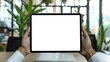 © Matcha_09 - Businessman holding iPad digital tablet with blank screen mockup in modern office setting. Replace with your app or website design.