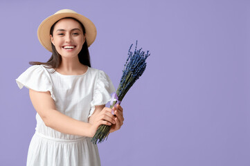 Poster - Beautiful happy young woman with bouquet of lavender flowers on lilac background