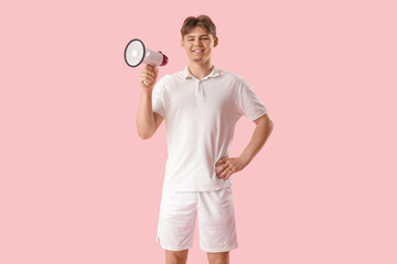 Wall Mural - Male lifeguard with loudspeaker on pink background