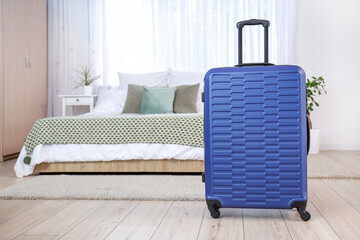 Canvas Print - Packed suitcase in interior of bedroom