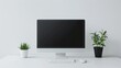 © Lem - Minimalist home office workspace with computer and plants.