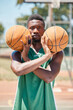 © peopleimages.com - Black man, basketball player and balls in fitness game, exercise match or training competition. Portrait, basketball court and sports athlete with wellness motivation, health goals and winner mindset
