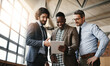 © StarDweller/peopleimages.com - Business, men and real estate with clients on tablet at empty office for rental contract or lease agreement. People, diversity and happy or smile with partnership for property and building sale