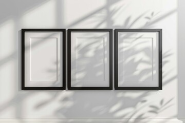 Canvas Print - Three empty picture frames hanging on a wall, ready for photos or artwork