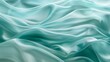 © liliyabatyrova - A delicate aqua fabric flows in graceful waves, creating a calming and ethereal visual