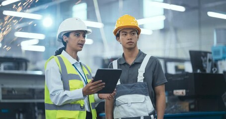 Leinwandbilder - Diverse Female and Male Technicians Operating Advanced Applications at a Modern Industrial Facility with a Tablet Computer. Professional Machinery Operators Program the Production Line
