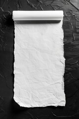 Wall Mural - A roll of white paper sits on top of a table, ready for use