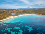 Aerial view of two yachts moored in the turquoise bay off the Plage de Balistra on the south east coast of the Mediterranean island of Corsica