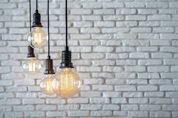 Wall Mural - Selective focused on vintage light bulbs with blurry white brick background  light