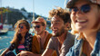 © Nate - A cheerful group of young people relaxes on a yacht at the yacht club, enjoying their student holidays at sea