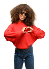 Poster - African american woman wearing sunglasses happy showing love with hands in heart shape expressing healthy and marriage symbol