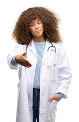 Poster - African american doctor woman, medical professional working holds hands welcoming in handshake pose, expressing trust and success concept, greeting