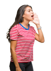 Canvas Print - Young beautiful arab woman over isolated background shouting and screaming loud to side with hand on mouth. Communication concept.