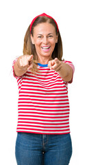 Poster - Beautiful middle age woman wearing casual stripes t-shirt over isolated background Pointing to you and the camera with fingers, smiling positive and cheerful