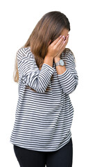 Sticker - Young beautiful brunette woman wearing stripes sweater over isolated background with sad expression covering face with hands while crying. Depression concept.