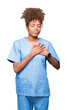 © Krakenimages.com - Young african american doctor woman over isolated background smiling with hands on chest with closed eyes and grateful gesture on face. Health concept.