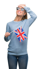 Poster - Beautiful young woman holding UK flag stressed with hand on head, shocked with shame and surprise face, angry and frustrated. Fear and upset for mistake.