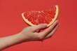 © ArtSpree - Macro shooting of a half cut pink grapefruit. Rotating. Isolated on the black background. Close-up. Macro.. Beautiful simple AI generated image in 4K, unique.