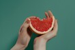 © ArtSpree - Blurred frame. Female hand close-up crushes grapefruit on a black background. Studio isolated background.. Beautiful simple AI generated image in 4K, unique.
