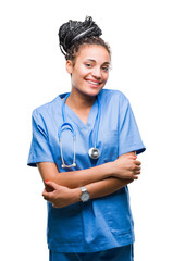 Wall Mural - Young braided hair african american girl professional surgeon over isolated background happy face smiling with crossed arms looking at the camera. Positive person.