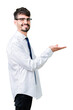 © Krakenimages.com - Young handsome business man wearing glasses over isolated background Pointing to the side with hand and open palm, presenting ad smiling happy and confident
