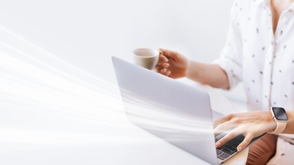 Canvas Print - Businesswoman drinking coffee while working at home