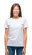 © Krakenimages.com - Young asian woman over isolated background sticking tongue out happy with funny expression. Emotion concept.