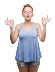 Wall Mural - Young blonde woman relax and smiling with eyes closed doing meditation gesture with fingers. Yoga concept.