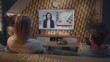 © Framestock - Back view of Caucasian couple watching breaking news about US presidential elections on big TV screen sitting on sofa at home. Television news broadcast with female news anchor displayed on TV display