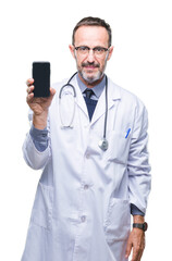 Wall Mural - Middle age senior hoary doctor man showing smartphone screen over isolated background with a confident expression on smart face thinking serious